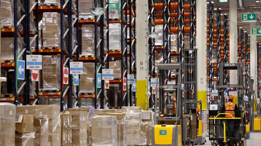 PRODUCTION - 27 November 2024, Mecklenburg-Western Pomerania, Dummerstorf: In Amazon's new logistics center, industrial trucks are on the move in the high-bay warehouse. The new center was officially opened in September. Around 500 people currently work at the site, and this figure is set to rise to 1,000 in the future. Around 1 million items are currently stored at the site. Photo: Bernd Wüstneck/dpa (Photo by Bernd Wüstneck/picture alliance via Getty Images)