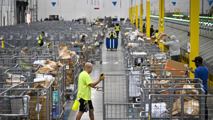 ORLANDO, FLORIDA  DECEMBER 2: Amazon employees work to fulfill same-day orders during Cyber Monday, one of the company busiest days of the year. The fulfillment center, one of Amazon largest for same-day deliveries, saw more than 200 workers sorting, packing and shipping items throughout Central Florida. On any given day, this location processes more than 20,000 packages, but during the holiday season, that number jumps to more than 80,000. (Photo by Miguel J. Rodriguez Carrillo/Getty Images)