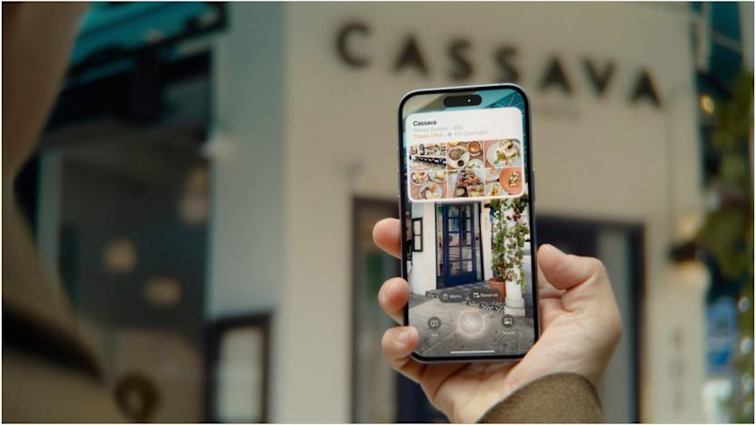 A person using Visual Intelligence on an iPhone 16 to find out information about a restaurant.