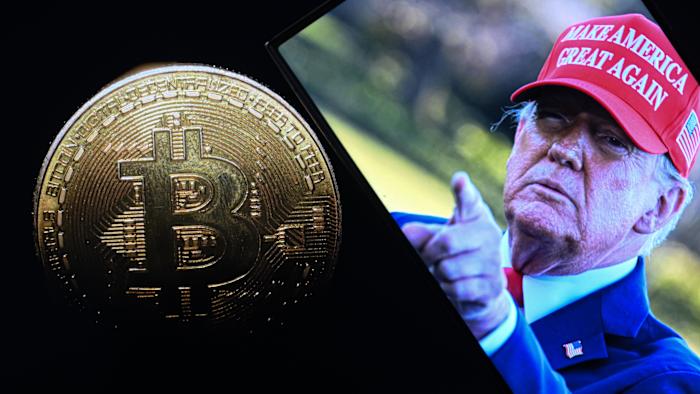 ANKARA, TURKIYE - MARCH 07: In this photo illustration, a 'Bitcoin' coin is displayed on mobile phone screen in front of the US President Donald J. Trump's photo in Ankara, Turkiye on March 07, 2025. (Photo by Harun Ozalp/Anadolu via Getty Images)