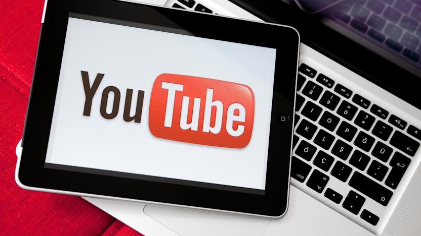 Antalya, Turkey - May 6, 2011: iPad is on the Apple Macbook Pro. Youtube logo on iPad screen.  Youtube is the largest video sharing website in the world.