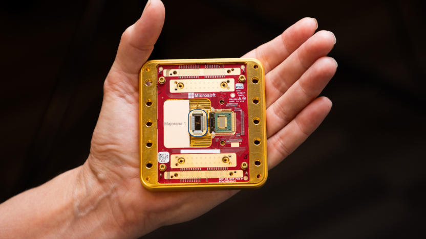 A hand holding a computer chip