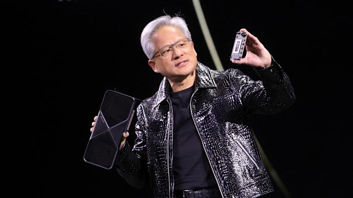 Nvidia CEO Jensen Huang holds a new Nvidia GeForce RTX 5090 graphics card as he gives a keynote address at CES 2025, an annual consumer electronics trade show, in Las Vegas, Nevada, U.S. January 6, 2025.  REUTERS/Steve Marcus