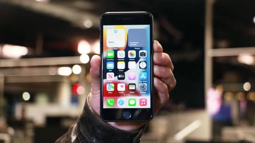 A hand holding a smartphone.