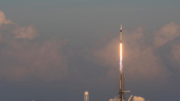 A rocket launching into space.