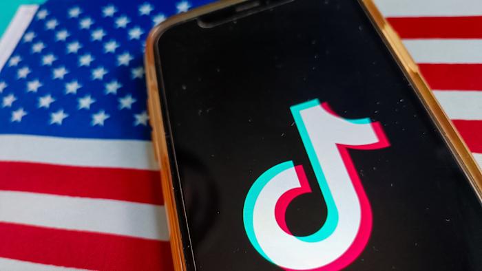 Illustration of Tik Tok, France, March 7, 2025. TikTok is a mobile application for sharing short creative videos. TikTok is developed by the Chinese company ByteDance. Flag of the United States, USA ((Stars and Stripes, stars and stripes, The Star-Spangled Banner). (Photo by Riccardo Milani / Hans Lucas / Hans Lucas via AFP) (Photo by RICCARDO MILANI/Hans Lucas/AFP via Getty Images)          