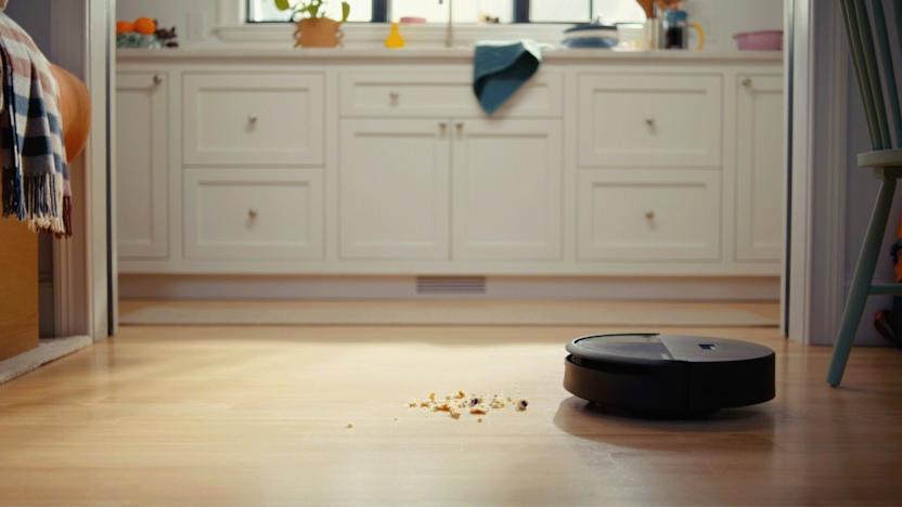 A vacuum chasing debris like Pac-Man.