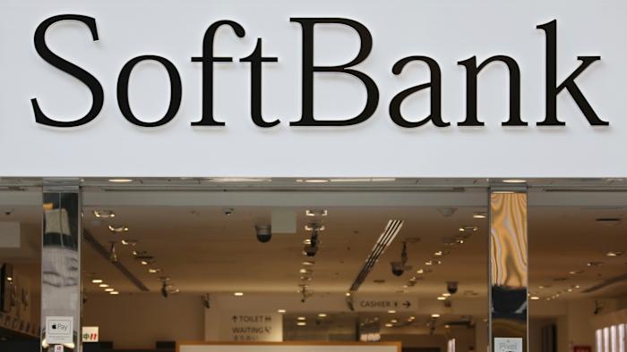 FILE - In this Dec. 4, 2018, file photo, people walk past in front of a SoftBank shop at Ginza shopping district in Tokyo. SoftBank Group Corp. says the price for the initial public offering of its Japanese mobile subsidiary has been set at 1,500 yen ($13) a share. (AP Photo/Koji Sasahara, File)