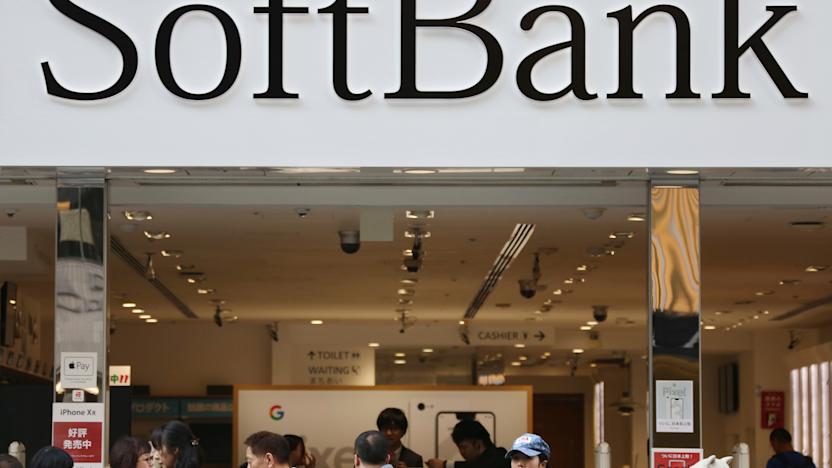 FILE - In this Dec. 4, 2018, file photo, people walk past in front of a SoftBank shop at Ginza shopping district in Tokyo. SoftBank Group Corp. says the price for the initial public offering of its Japanese mobile subsidiary has been set at 1,500 yen ($13) a share. (AP Photo/Koji Sasahara, File)