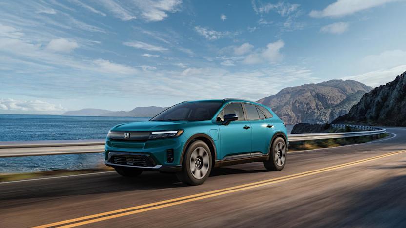 A blue Honda Prologue electric SUV driving down the Pacific Coast Highway.