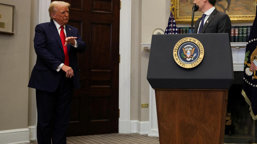U.S. President Donald Trump gestures after delivering remarks on AI infrastructure, as OpenAI CEO Sam Altman at the Roosevelt room at White House in Washington, U.S., January 21, 2025.  REUTERS/Carlos Barria