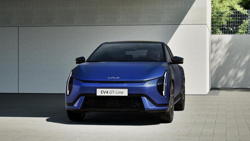 A blue sedan with a plate that says EV4