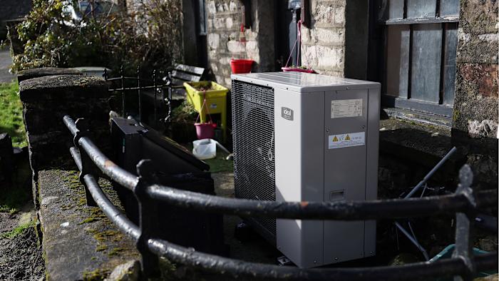 An Ideal Heating heat pump is seen in front of a cottage in Newbiggin-on-Lune, Britain, February 18, 2024. REUTERS/Suzanne Plunkett
