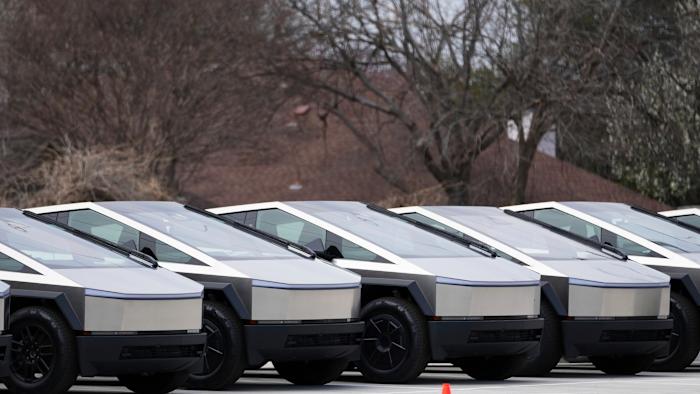 Tesla Cybertrucks are seen parked at a dealership Wednesday, March 12, 2025, in Plano, Texas. (AP Photo/Julio Cortez)